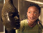 Woman looking at an African artefact in the British Museum