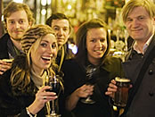 Group of people in a traditional London pub