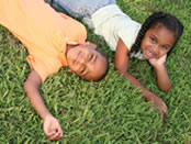 Kids relaxing on grass