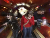 Young people on escalator at the Natural History Museum