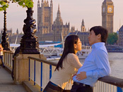 A couple enjoy a stroll along London's south bank