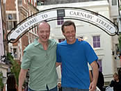Two men enjoy shopping on Carnaby Street in London