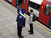 Tube train, platform and guard. Copyright Transport for London 2005