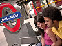 Couple sitting on a bench waiting at Canada Water Tube station. Photo: Eric Nathan