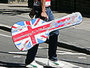 Four people carrying guitar cases on the Abbey Road pedestrian crossing, made famous by the Beatles. ©VisitBritain / Jack Barnes