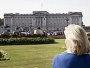Mature couple looking at Buckingham Palace. ©VisitBritain / Simon Winnall