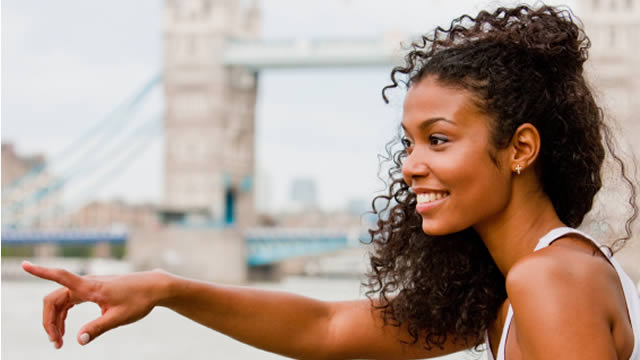 Woman on South Bank Tower Bridge in background
