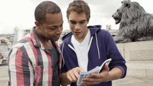 Looking at a London map. Copyright Britain in View
