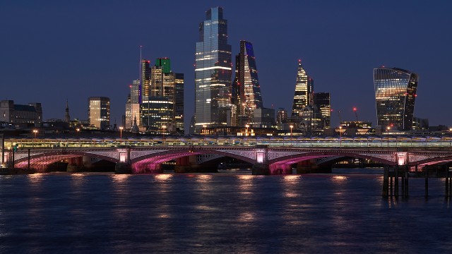 Blackfriars Bridge and the Illuminated River at night time.