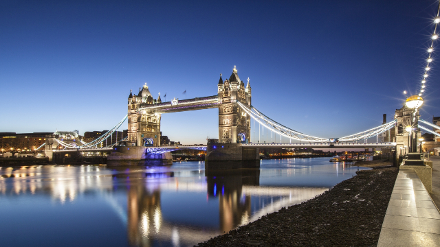 Riverside view of Tower Bridge on a clear night.