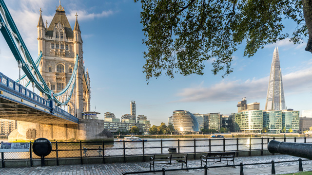 View of Tower Bridge, the Shard, the cityhall and the Thames riverside during golden hour.