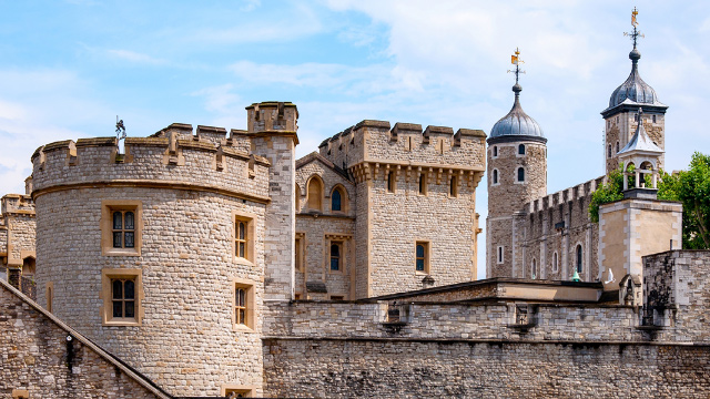 The Tower of London castle on a clear day with blue skies.