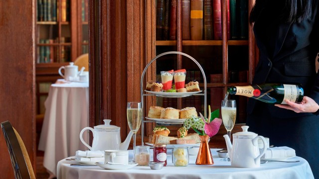 Champagne afternoon tea in The Library at the London Marriott Hotel County Hall. Image courtesy of Buy a gift.