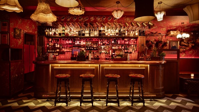 The 1920s Chicago-inspired bar, complete with red velvet bar stools and retro lampshades, at Barts in London.