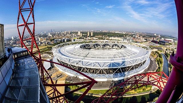 A london stadium and the view of london from the ArcelorMittal Orbit.