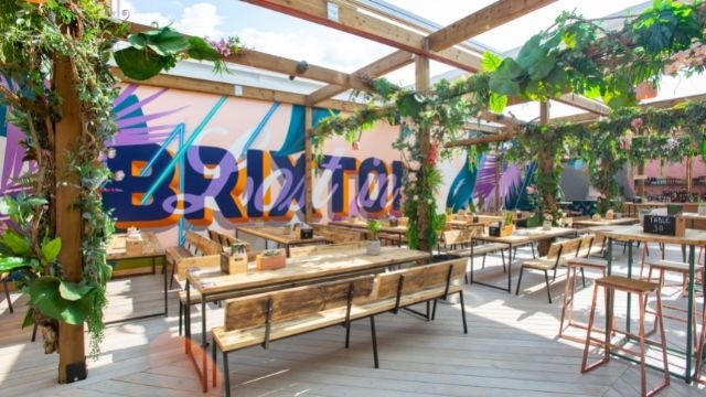 The sunny outdoor dining space at the London restaurant and bar Lost in Brixton.