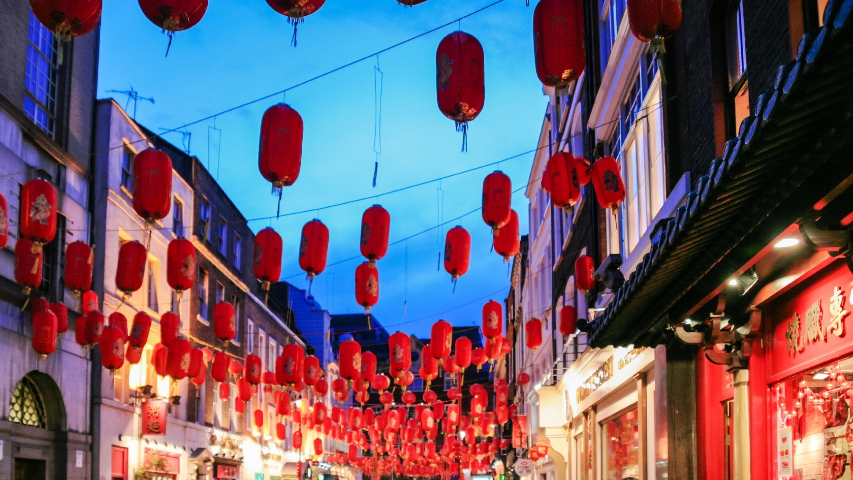 Red and bright Chinese lanners at night-time in Chinatown in London.
