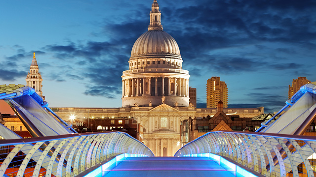 St Paul's Cathedral after dark, viewed from the Millennium Bridge in the City, London.