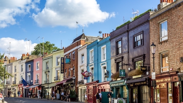 Colourful buildings along Portobello Road in Notting Hill, west London, on a sunny day