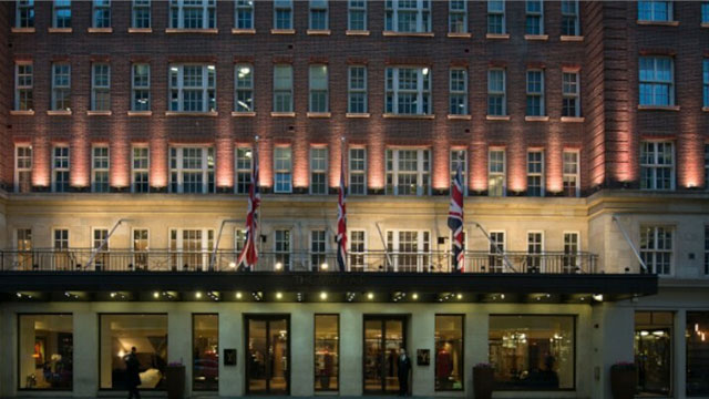 The exterior of The Mayfair Hotel London at night time