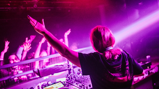DJ waving to the crowd at Egg nightclub in London