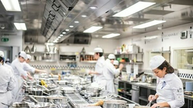 A kitchen of Le Cordon Bleu chefs cooking food