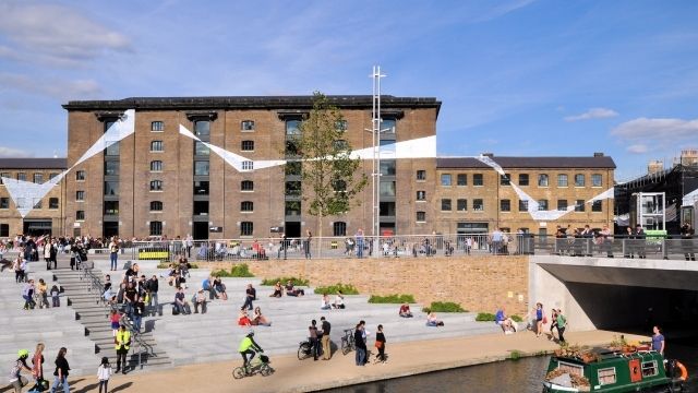 People enjoy a sunny day out at Granary Square.