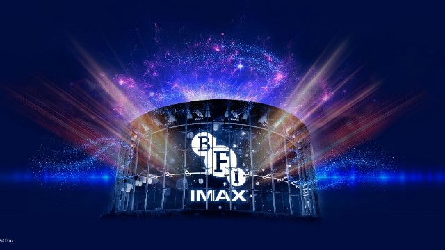 A nighttime view of the BFI IMAX cinema at Waterloo with the BFI IMAX logo lit up.