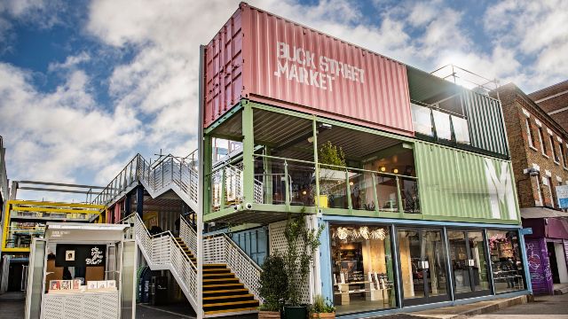 A colourful market made out of recycled shipping containers.