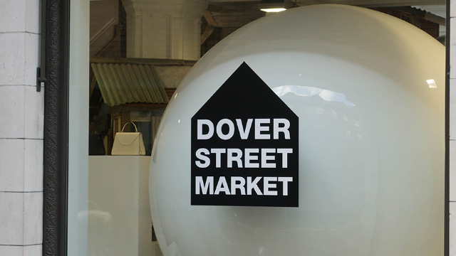 Exterior view through a window at Dover Street Market sign in London