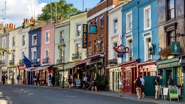 The colourful houses and shops along Portobello Road on a sunny day
