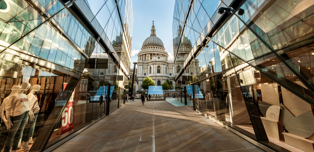 A view towards St Paul's Cathedral taken between two reflective glass walls at One New Change.