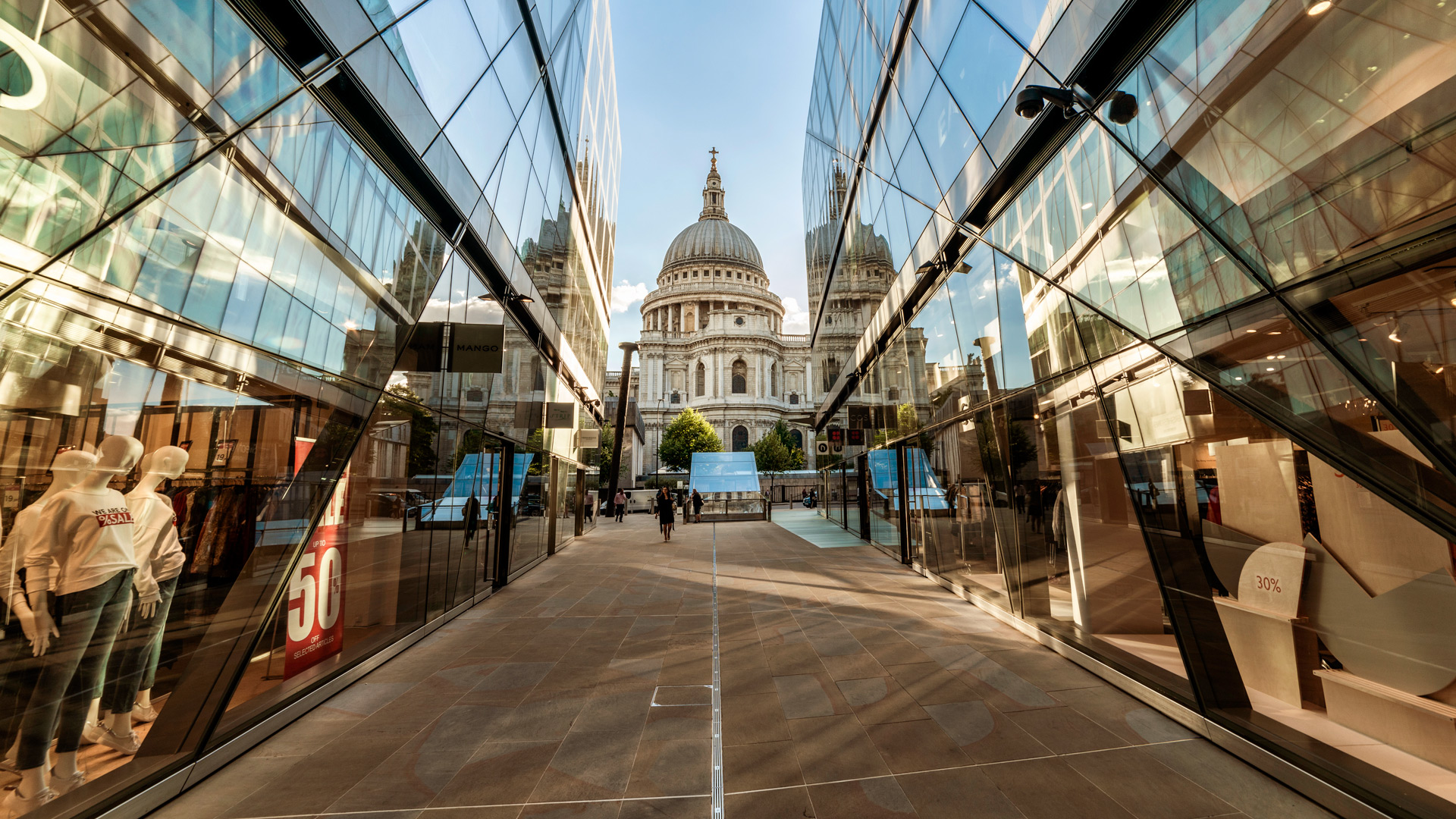 A view towards St Paul's Cathedral taken between two reflective glass walls at One New Change.