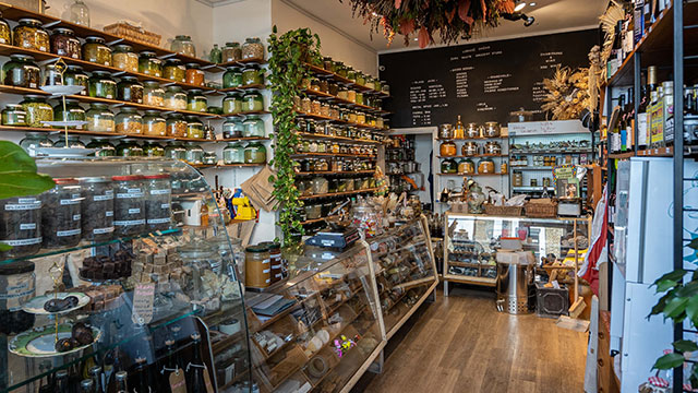 The interior of zero waste grocery store Liberté Chérie filled wth jars and locally sourced food