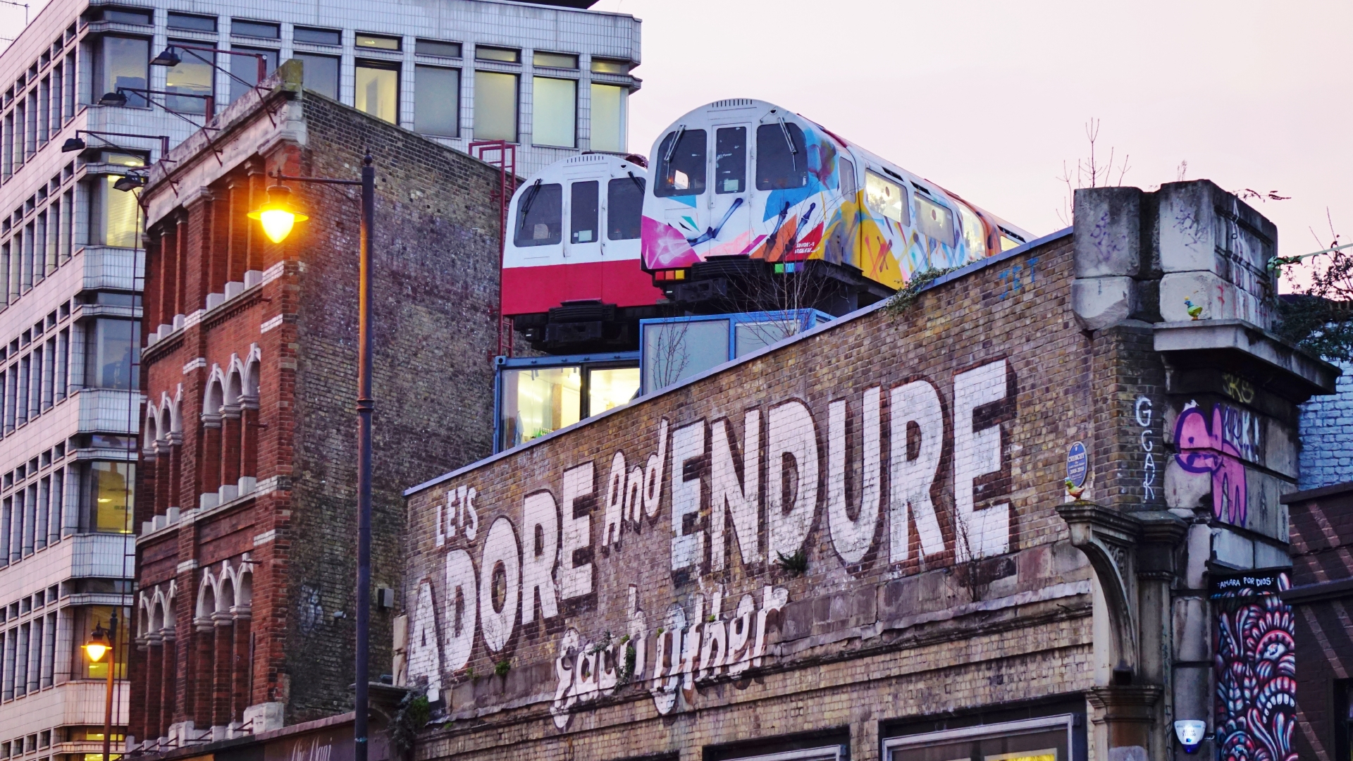 Street art and tube train offices in Shoreditch.