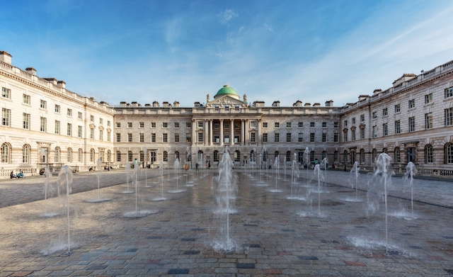 Fountains in the courtyard at Somerset House in London on a sunny day.