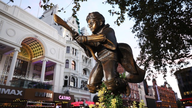 A sculpture of Harry Potter on his broom in a Quidditch attire in Leicester Square. 