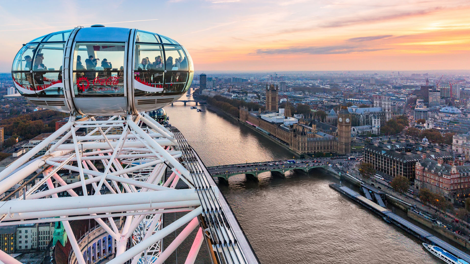 View of London including the Thames and Big Ben from the London Eye with a capsule in the foreground.