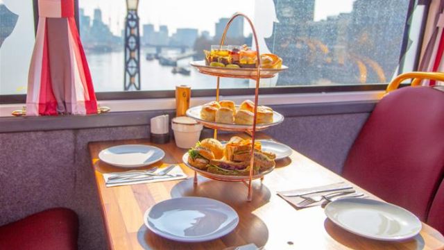 A delightful afternoon tea on a double decker bus with views of London.