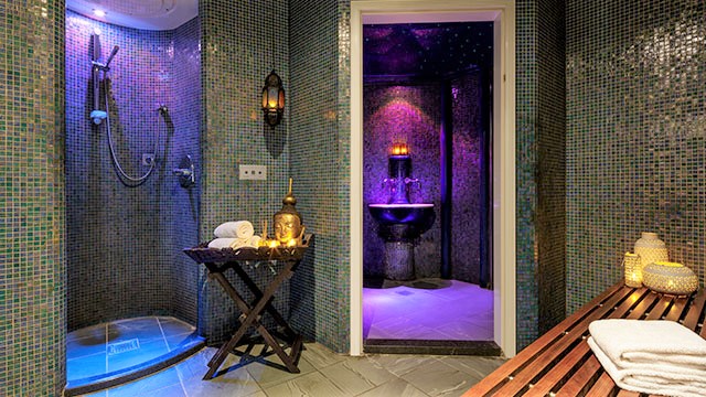 A steam room at the East River Spa decorated with buddhas and lanterns