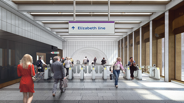 A group of commuters pass the gates to access to the Elizabeth Line in London