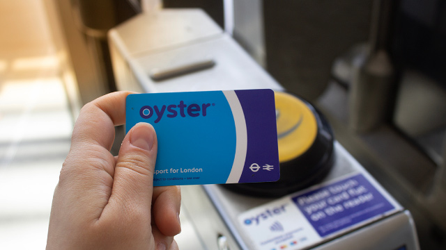 Use an Oyster card to ride the London Underground. Image courtesy of Shutterstock. Oyster card in front of a card reader on the London Underground
