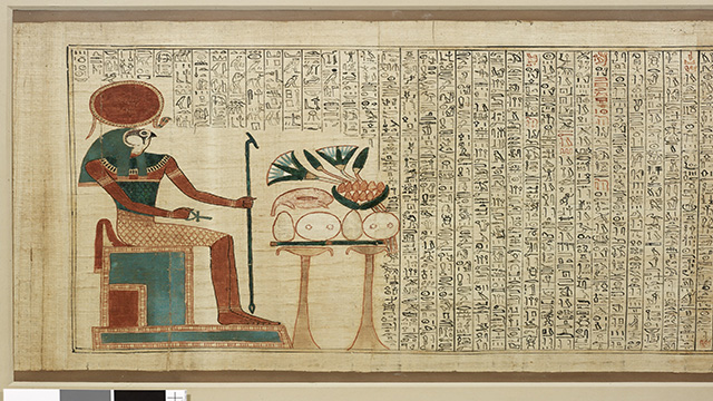 Papyrus showing one of the gods of Acient Egypt on the left, and text under hieroglyph format.