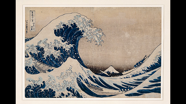 Hokusai's image showing a choppy dark blue swa and a "great wave" with foam.