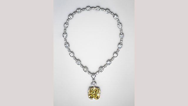 A diamond Tiffany necklace with a large yellow one-carat diamond