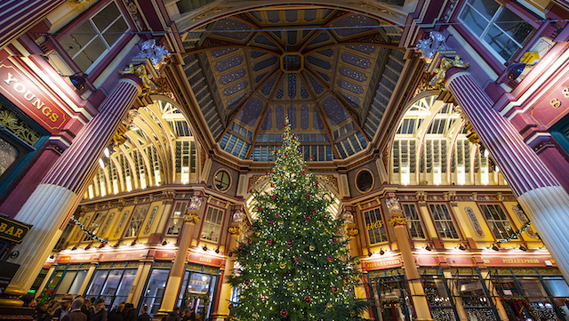 Decorated Christmas tree surrounded by the ornate building of Leadenhall Market in London