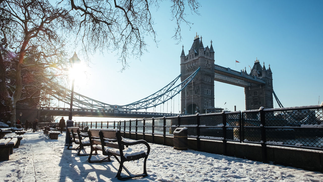 The iconic Tower Bridge in London is surrounded by snow