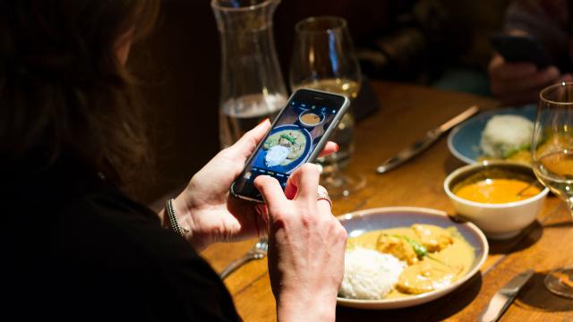 Enjoy some of London's top eateries during the London Restaurant Festival. Credit: Joshua Tucker. A photo of a person taking a picture of the food using a phone.