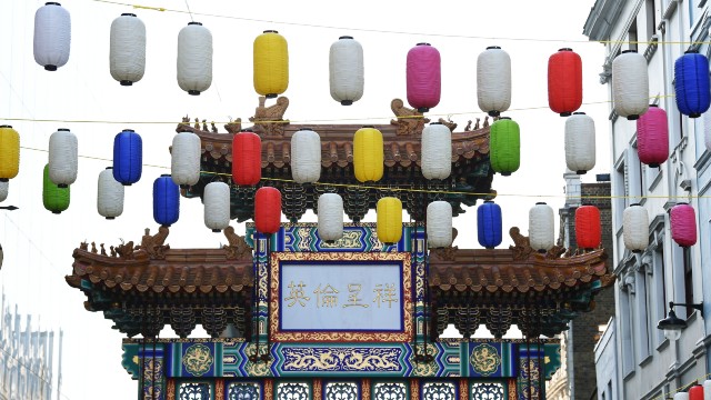 Wander the streets of Chinatown as it's adorned with colourful lanterns. Credits: Stuart Wilson/Getty Photography. The iconic Chinatown gate with colourful lanterns at the top.