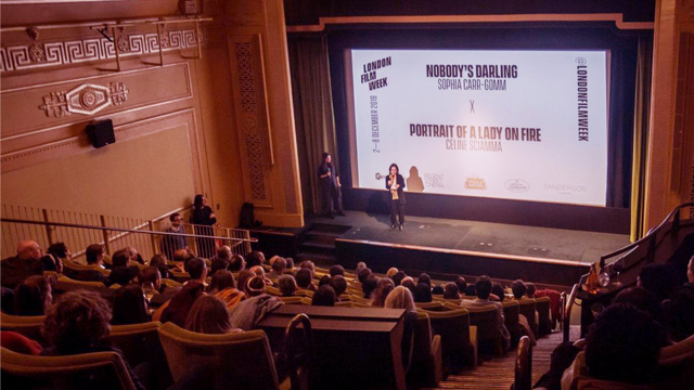 Speaker on stage in front of an audience at London Film Week